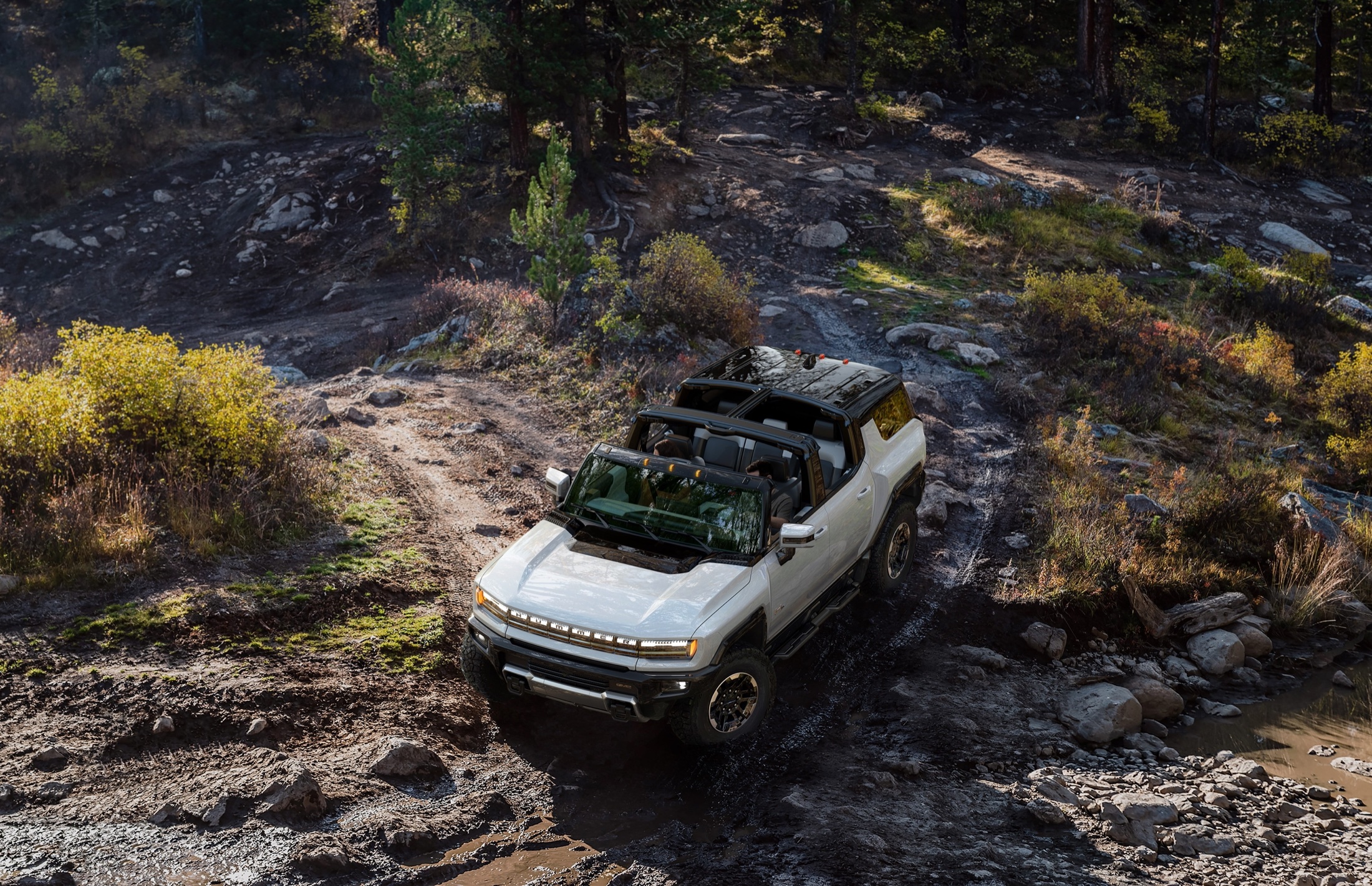 Green Hummer EV SUV with open roof panels